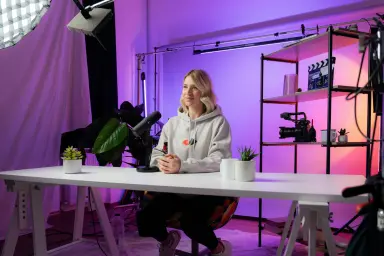 A content creator or social media influencer filming content on a set